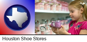 Houston, Texas - little girl holding a shoe in a shoe store