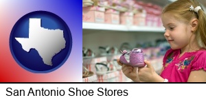 San Antonio, Texas - little girl holding a shoe in a shoe store