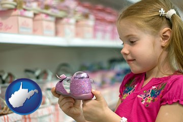 little girl holding a shoe in a shoe store - with West Virginia icon